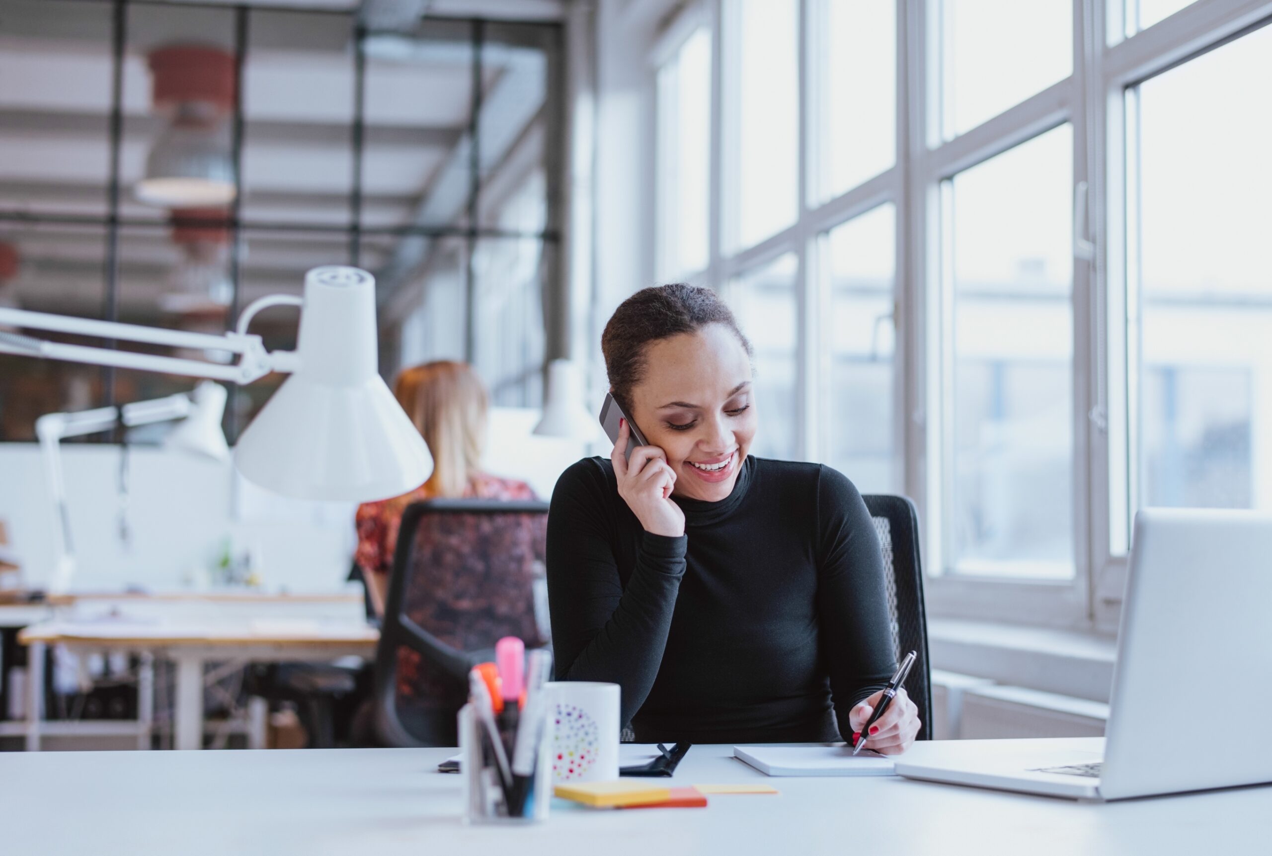 Bigstock Happy Young Woman Taking Notes 86676881